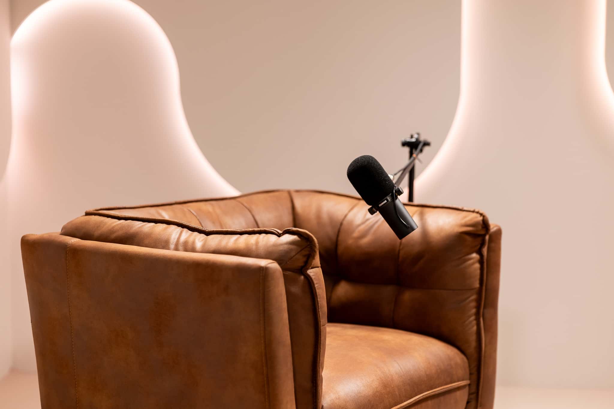 Halo Set – Architectural Podcast Studio with Signature Light Features & Leather Seating - Podcast Space in Dubai