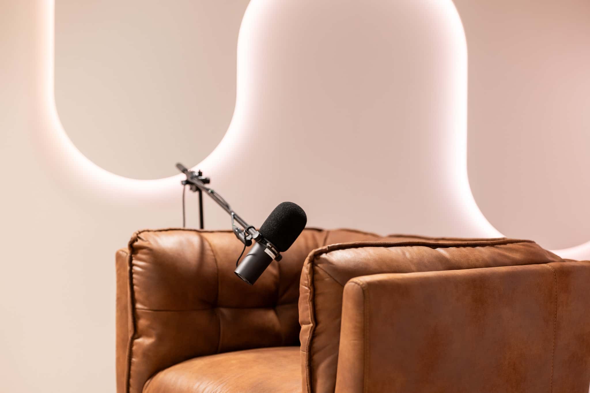 Halo Set – Architectural Podcast Studio with Signature Light Features & Leather Seating - Podcast Space in Dubai