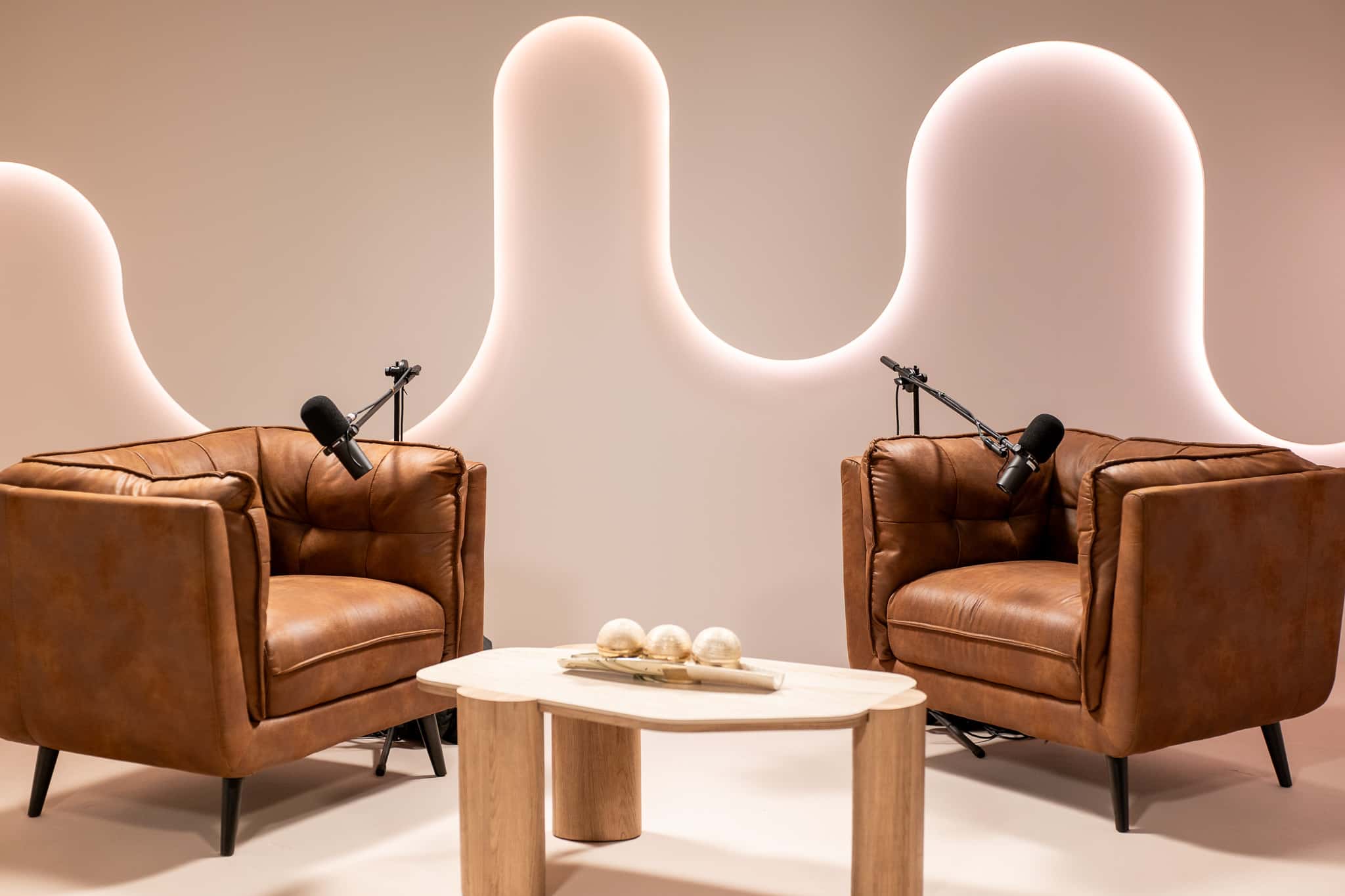 Halo Set – Architectural Podcast Studio with Signature Light Features & Leather Seating - Podcast Space in Dubai