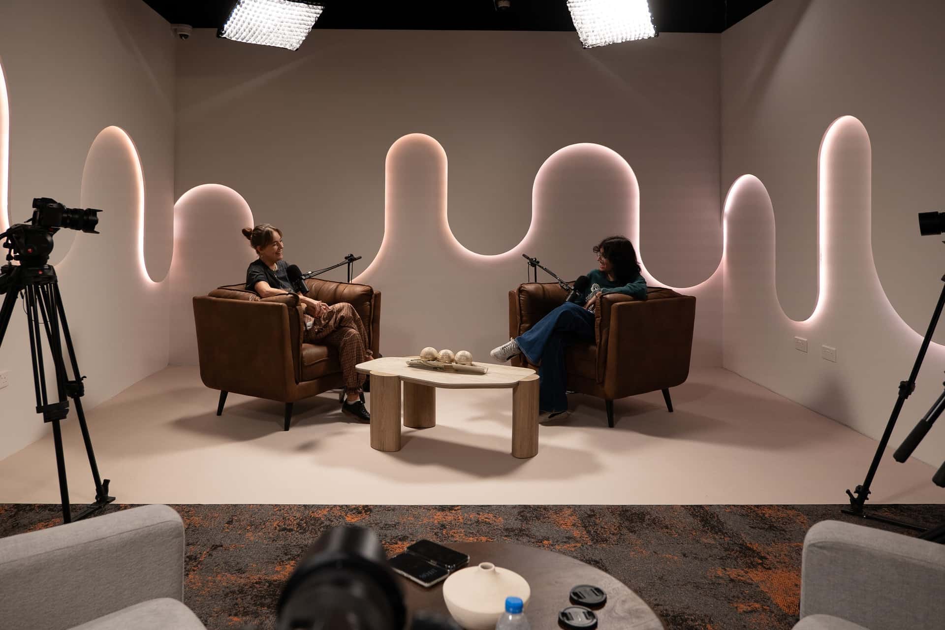 Halo Set – Architectural Podcast Studio with Signature Light Features & Leather Seating - Podcast Space in Dubai
