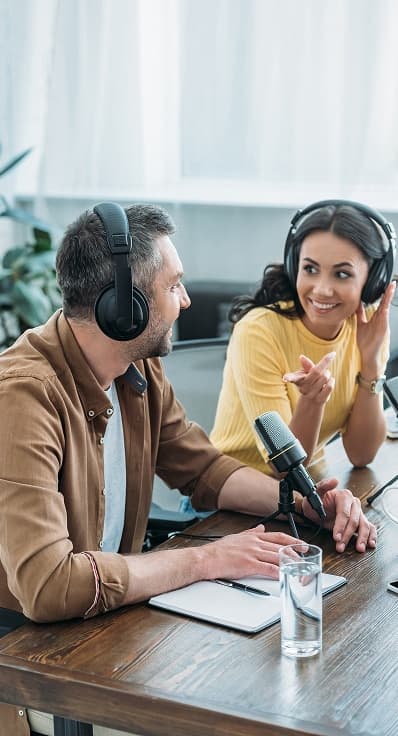 Creators recording a podcast around a studio table