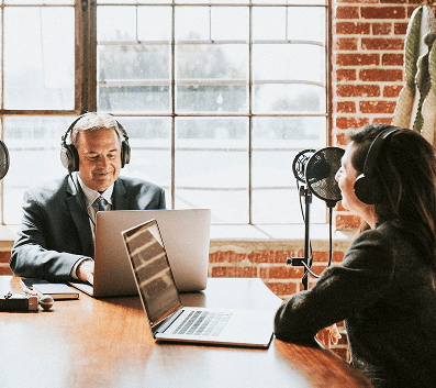 Podcast planning session with recording equipment